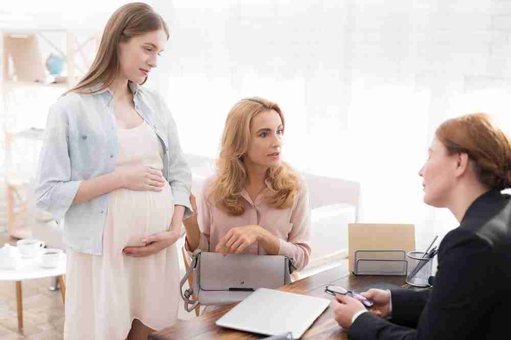 Healthcare provider offering reassurance and guidance for post-delivery and newborn care