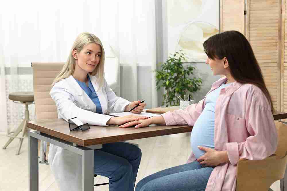 Compassionate reproductive health provider offering guidance to a patient in Temecula.
